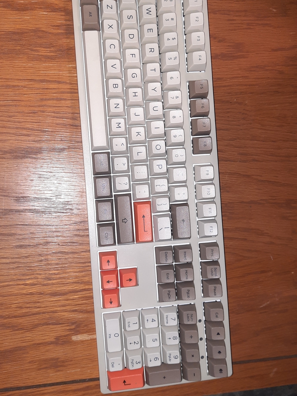 White and Gray Mechanical Keyboard with Orange Accent Keys